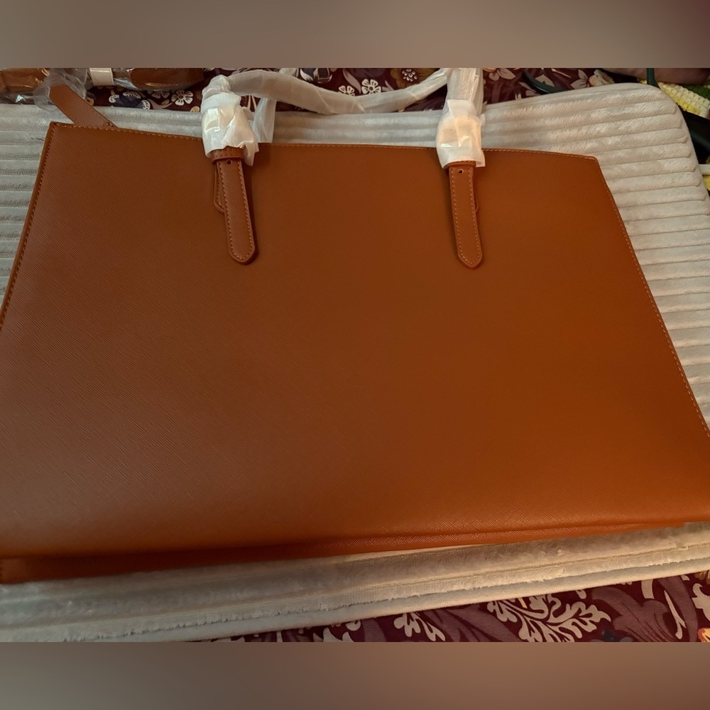 Elegant Tan faux leather Tote Bag Never used . Great for business and travel -